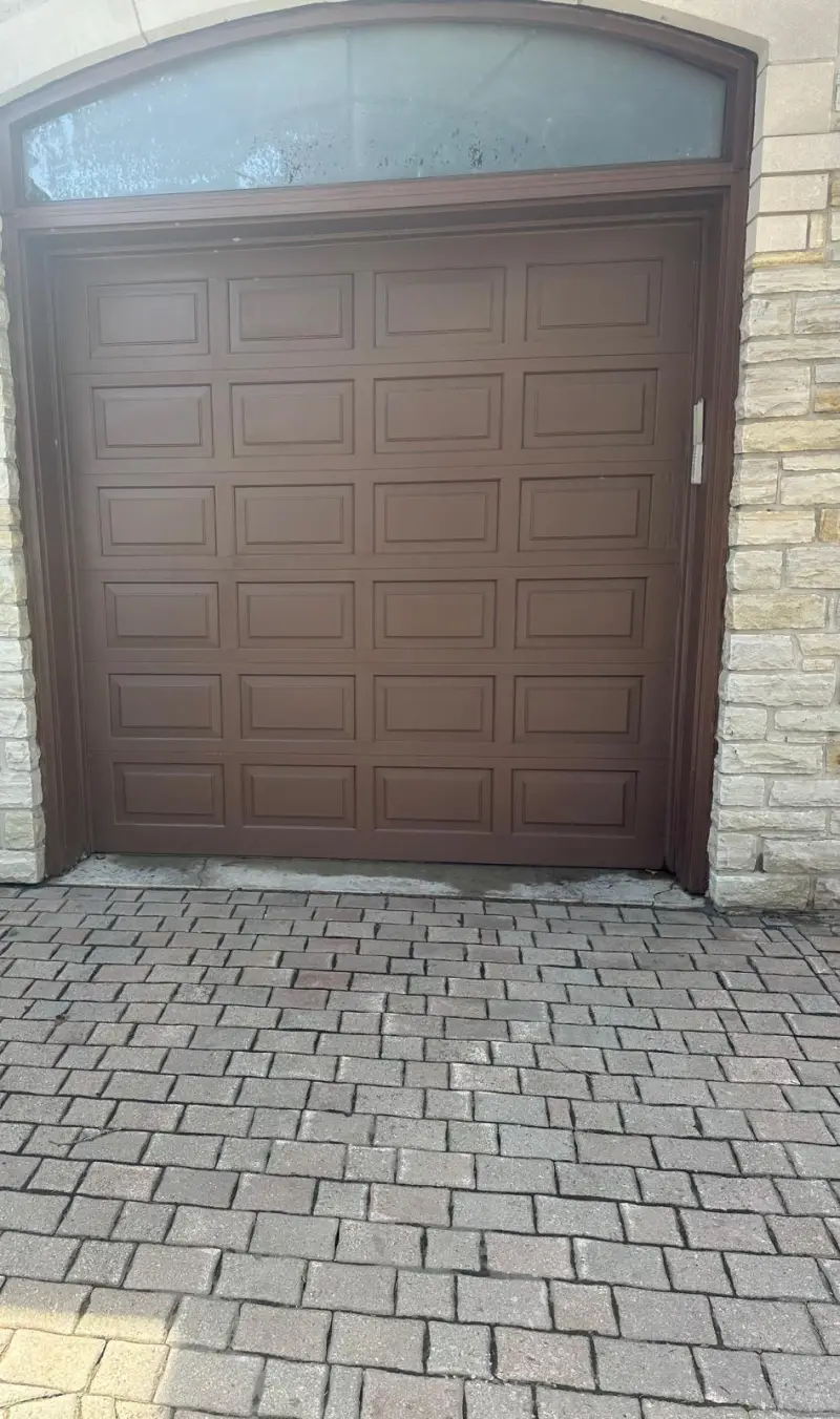 Woodgrain insulated garage door with windows