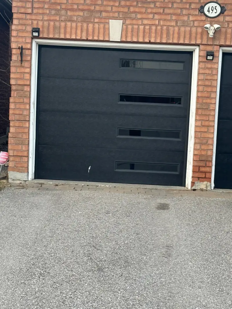 Garage door paired with cedar siding