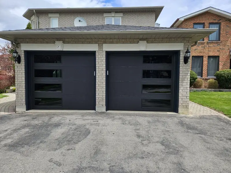 Technician aligning garage door panel