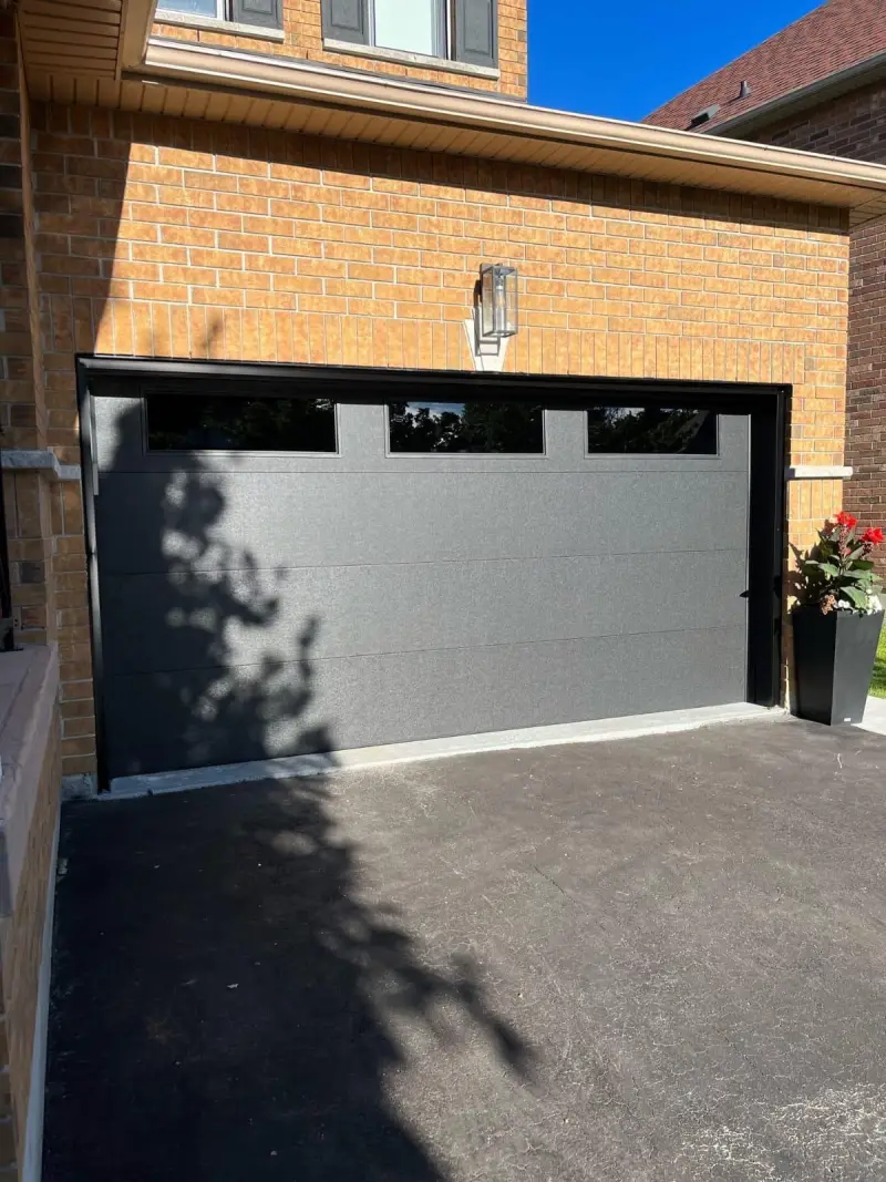 Triple bay garage with new doors